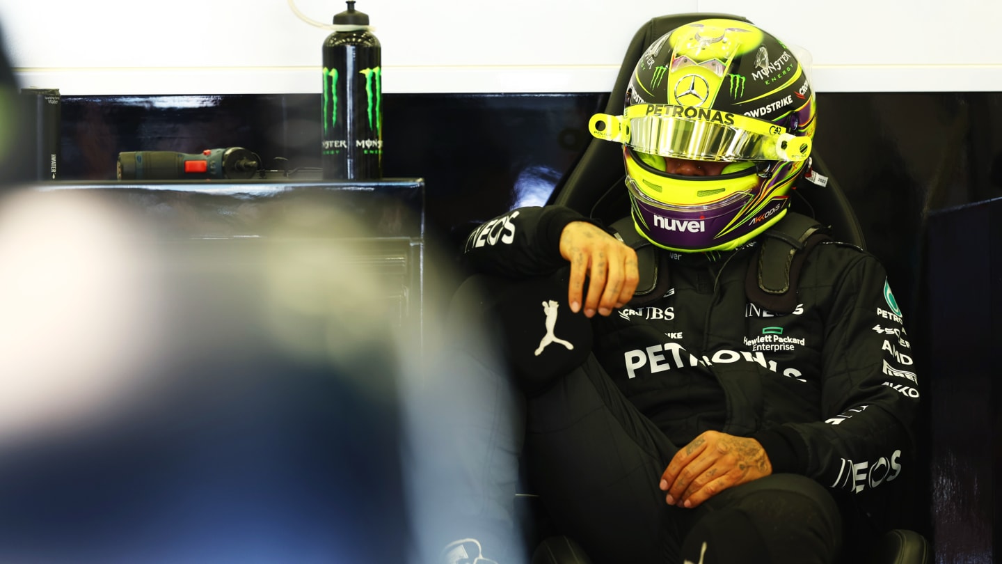 BAHRAIN, BAHRAIN - FEBRUARY 24: Lewis Hamilton of Great Britain and Mercedes looks on in the garage