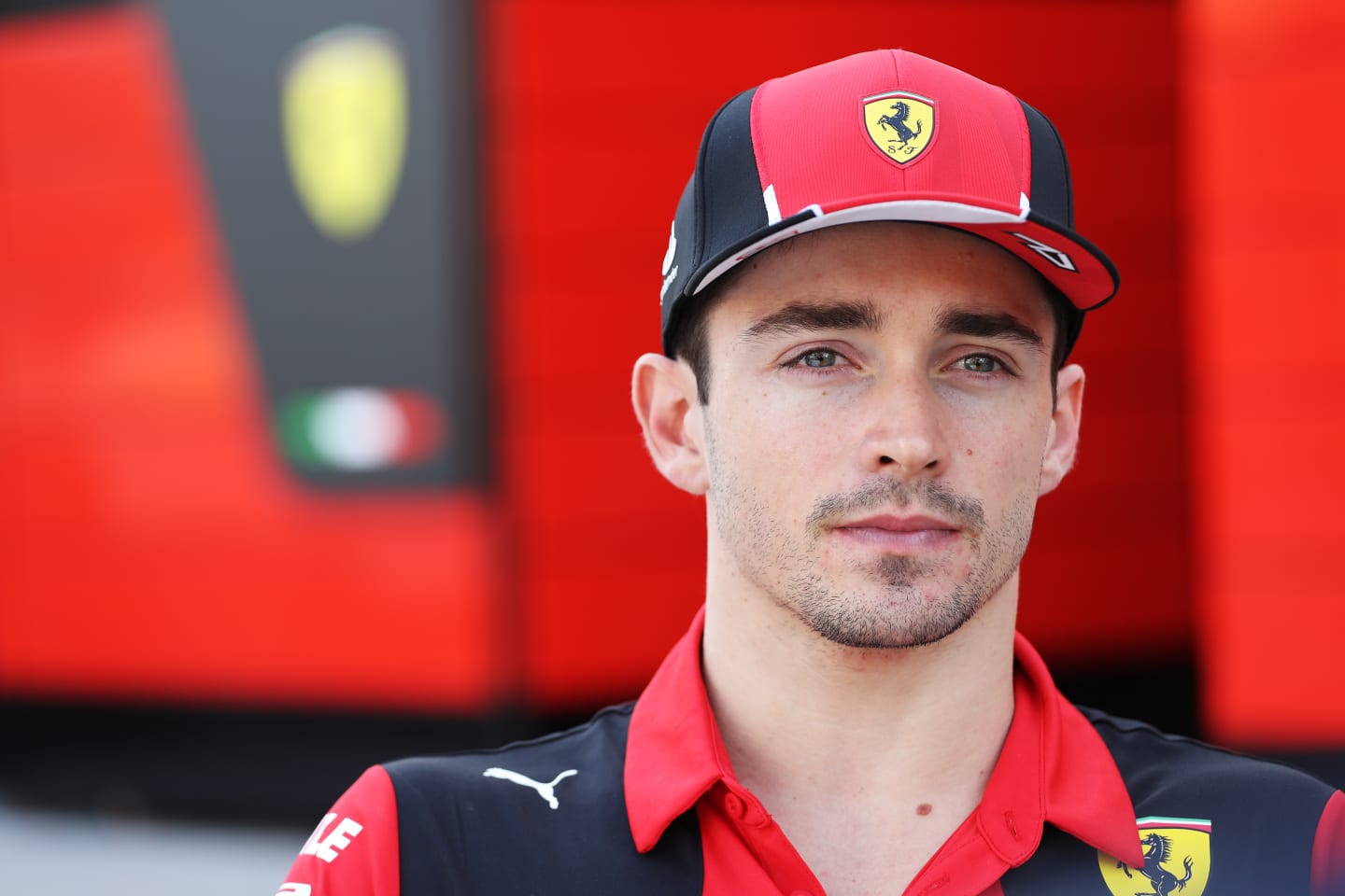 BAHRAIN, BAHRAIN - FEBRUARY 25: Charles Leclerc of Monaco and Ferrari looks on in the Paddock