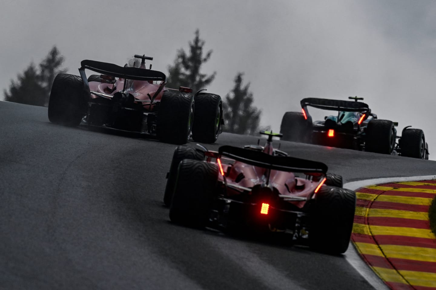 Ferrari's Monegasque driver Charles Leclerc (L), Ferrari's Spanish driver Carlos Sainz Jr (down) and Mercedes' British driver Lewis Hamilton (R) compete during the sprint shootout ahead of the Formula One Belgian Grand Prix at the Spa-Francorchamps Circuit in Spa on July 29, 2023. (Photo by JOHN THYS / AFP) (Photo by JOHN THYS/AFP via Getty Images)