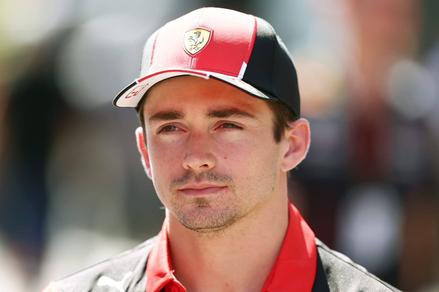 SPIELBERG, AUSTRIA - JUNE 29: Charles Leclerc of Monaco and Ferrari talks to the media in the