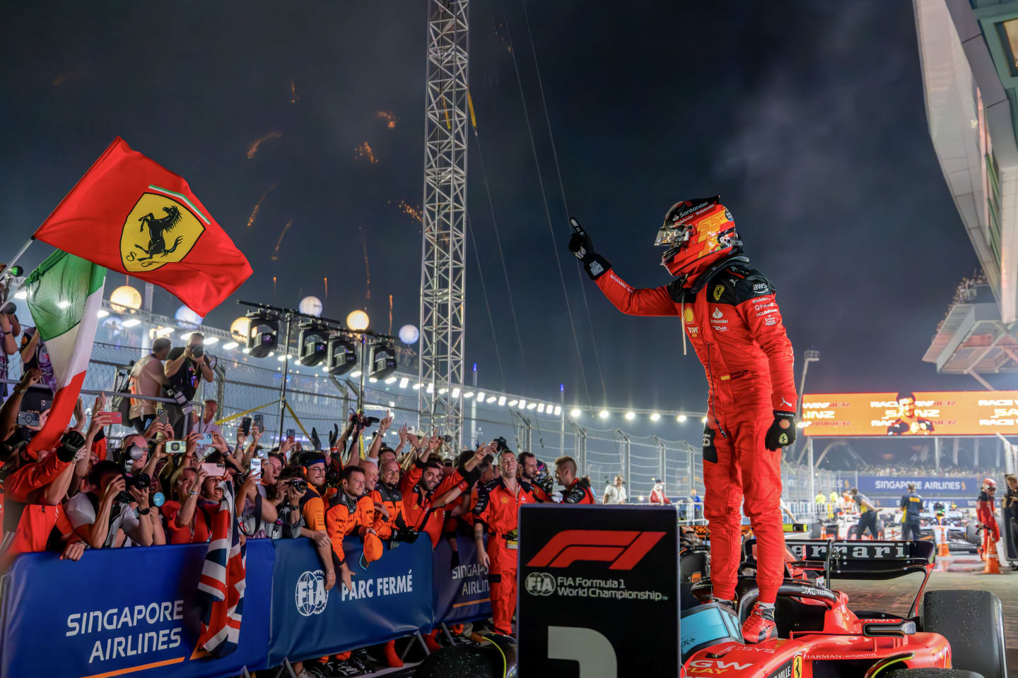 SINGAPORE, SINGAPORE - SEPTEMBER 17: Carlos Sainz Jr of Spain and Scuderia Ferrari celebrates his