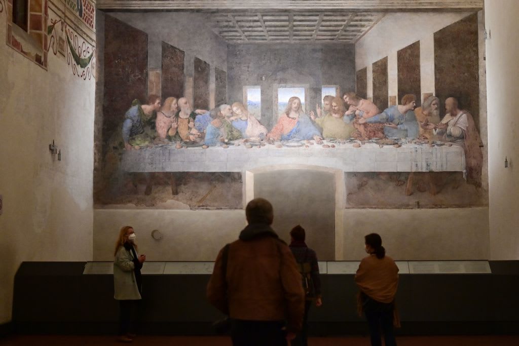 Visitors watch "The Last Supper" (Il Cenacolo or L'Ultima Cena), Italian artist Leonardo da Vinci's