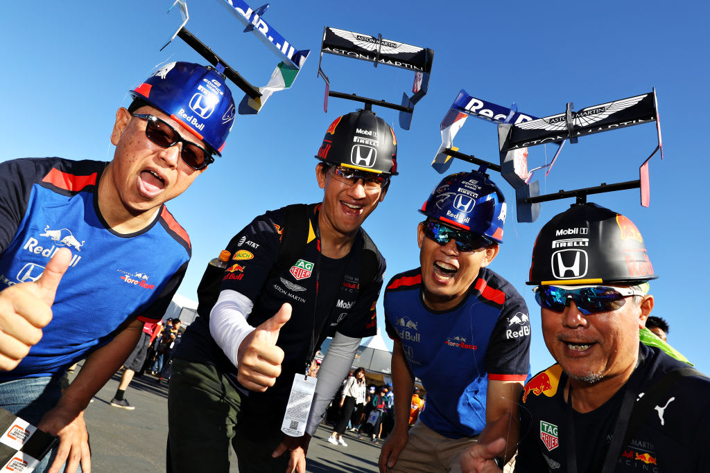 SUZUKA, JAPAN - OCTOBER 13: Red Bull Racing and Scuderia Toro Rosso fans show their support before