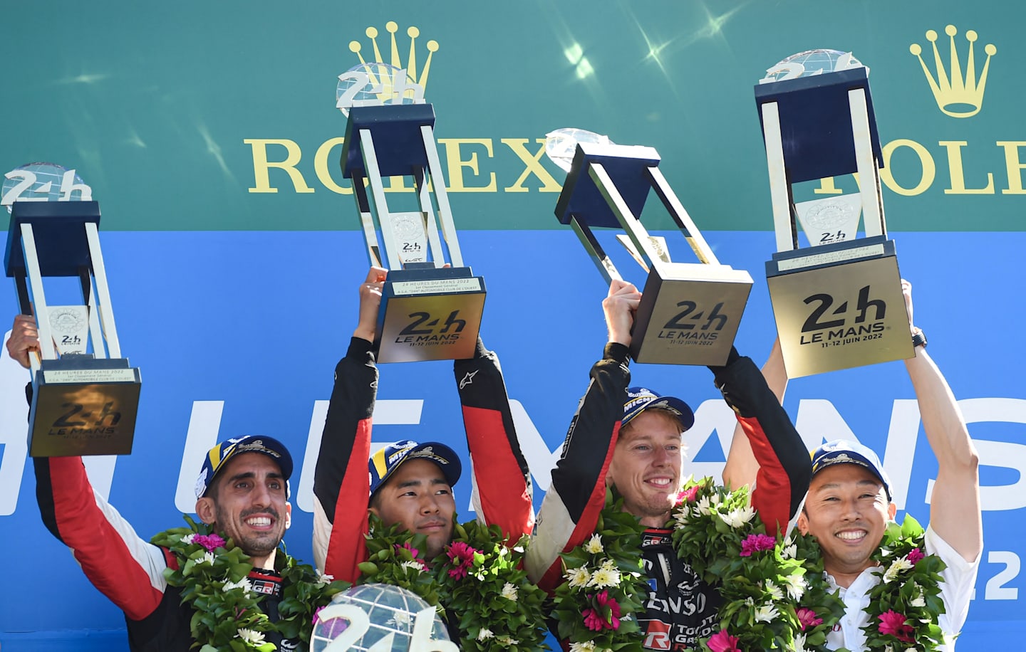 Sebastien Buemi, Ryo Hirakawa, Brendon Hartley and Kazuki Nakajima celebrate after winning Le Mans 24 Hours endurance race on June 12, 2022. -  (Photo by JEAN-FRANCOIS MONIER / AFP) (Photo by JEAN-FRANCOIS MONIER/AFP via Getty Images)