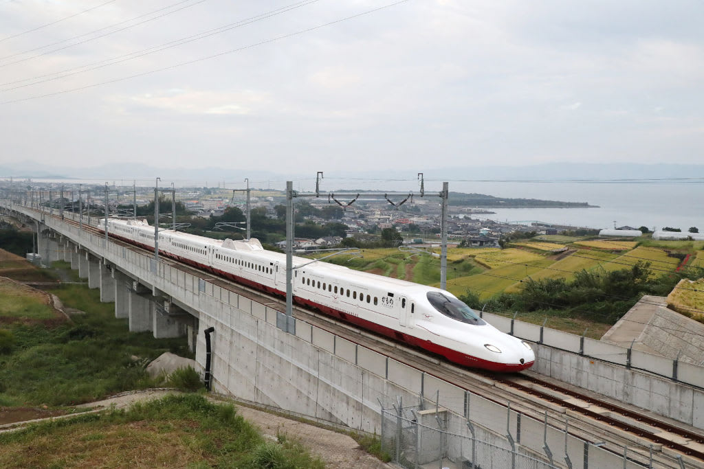 The new "shinkansen" line, or bullet train, passes by Omura Bay near the city of Omura, Nagasaki