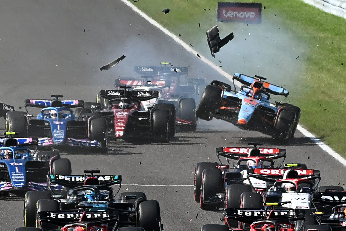 TOPSHOT - Williams' Thai driver Alexander Albon (back, R) collides with Alfa Romeo's Finnish driver