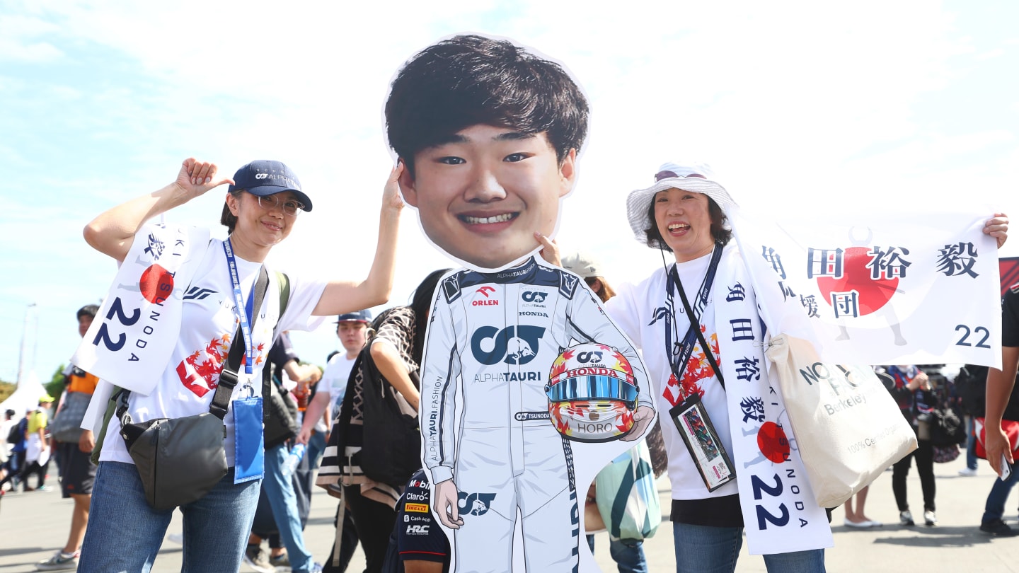 SUZUKA, JAPAN - SEPTEMBER 24: Fans show their support of Yuki Tsunoda of Japan and Scuderia