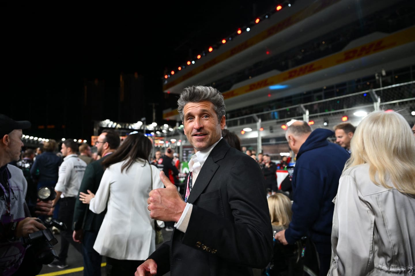 Actor Patrick Dempsey tours the grid before the start of the Las Vegas Formula One Grand Prix on November 18, 2023, in Las Vegas, Nevada. (Photo by ANGELA WEISS / AFP) (Photo by ANGELA WEISS/AFP via Getty Images)