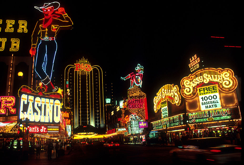 View along of hotels, casinos, and their neon signs along Fremont Street, Las Vegas, Nevada, 1980s