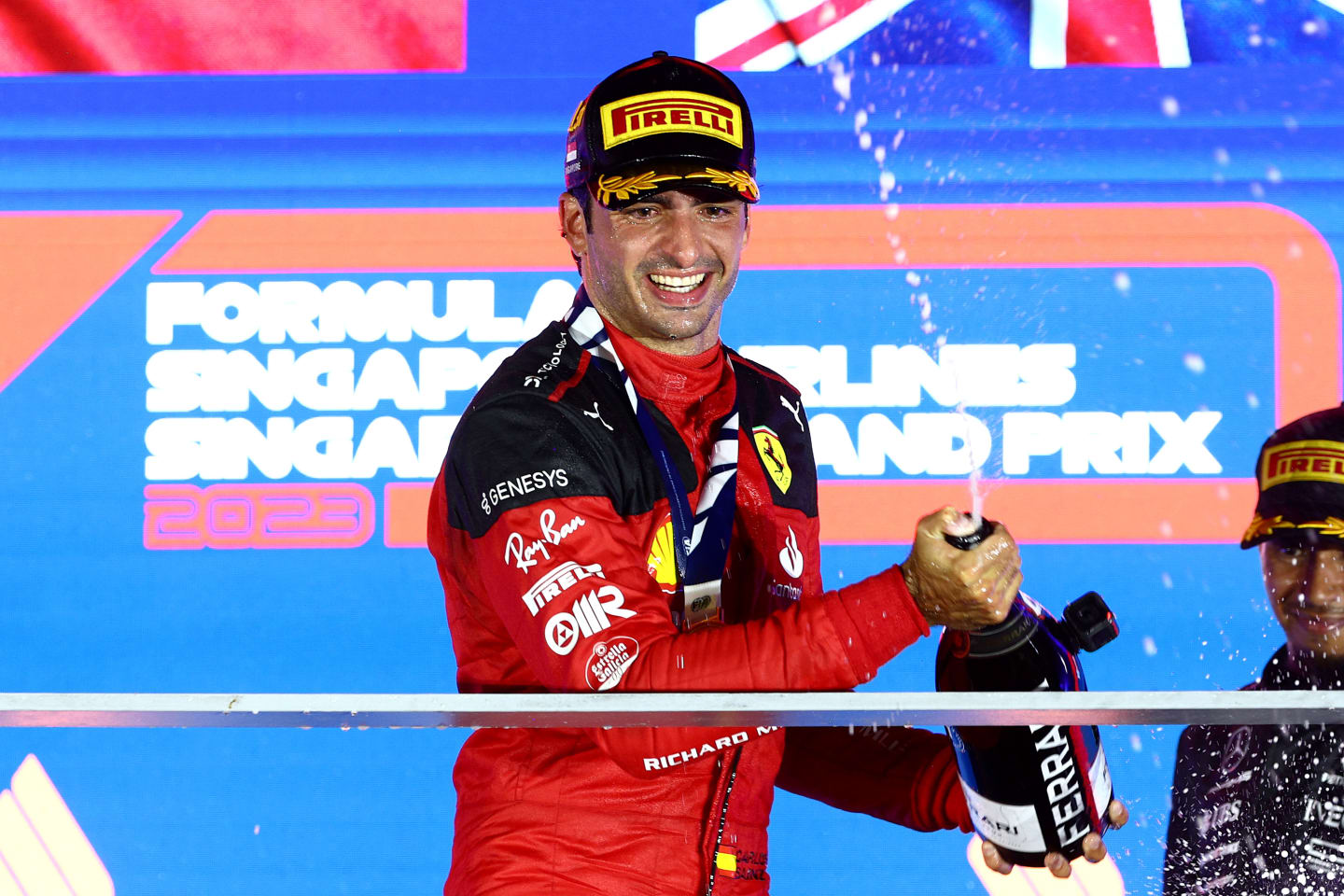 SINGAPORE, SINGAPORE - SEPTEMBER 17: Race winner Carlos Sainz of Spain and Ferrari celebrates on