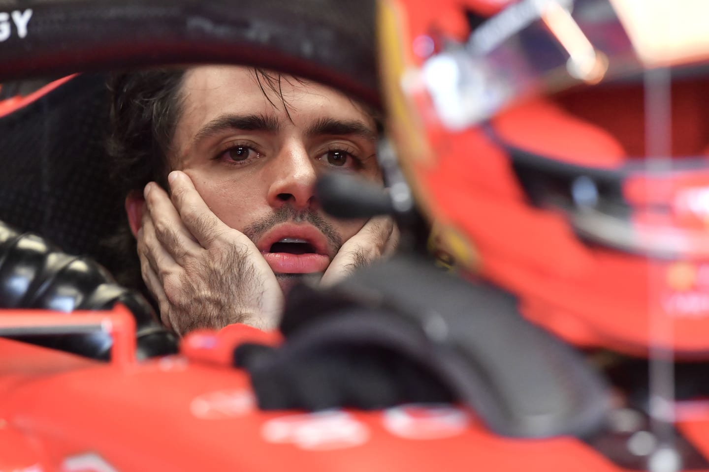 SAO PAULO, BRAZIL - NOVEMBER 3: Carlos Sainz of Spain sits in the (55) Ferrari SF-23 in the garage