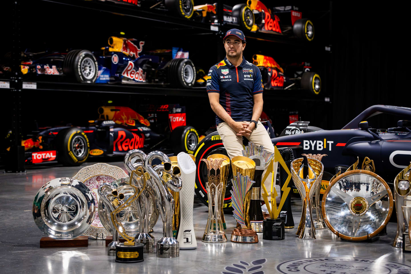 MILTON KEYNES, ENGLAND - DECEMBER 13: Sergio Perez of Mexico and Oracle Red Bull Racing poses for a