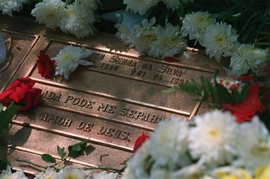 23 MAR 1995:  FLORAL TRIBUTES SURROUND THE GRAVE OF FORMER WORLD CHAMPION AYRTON SENNA OF BRAZIL AT