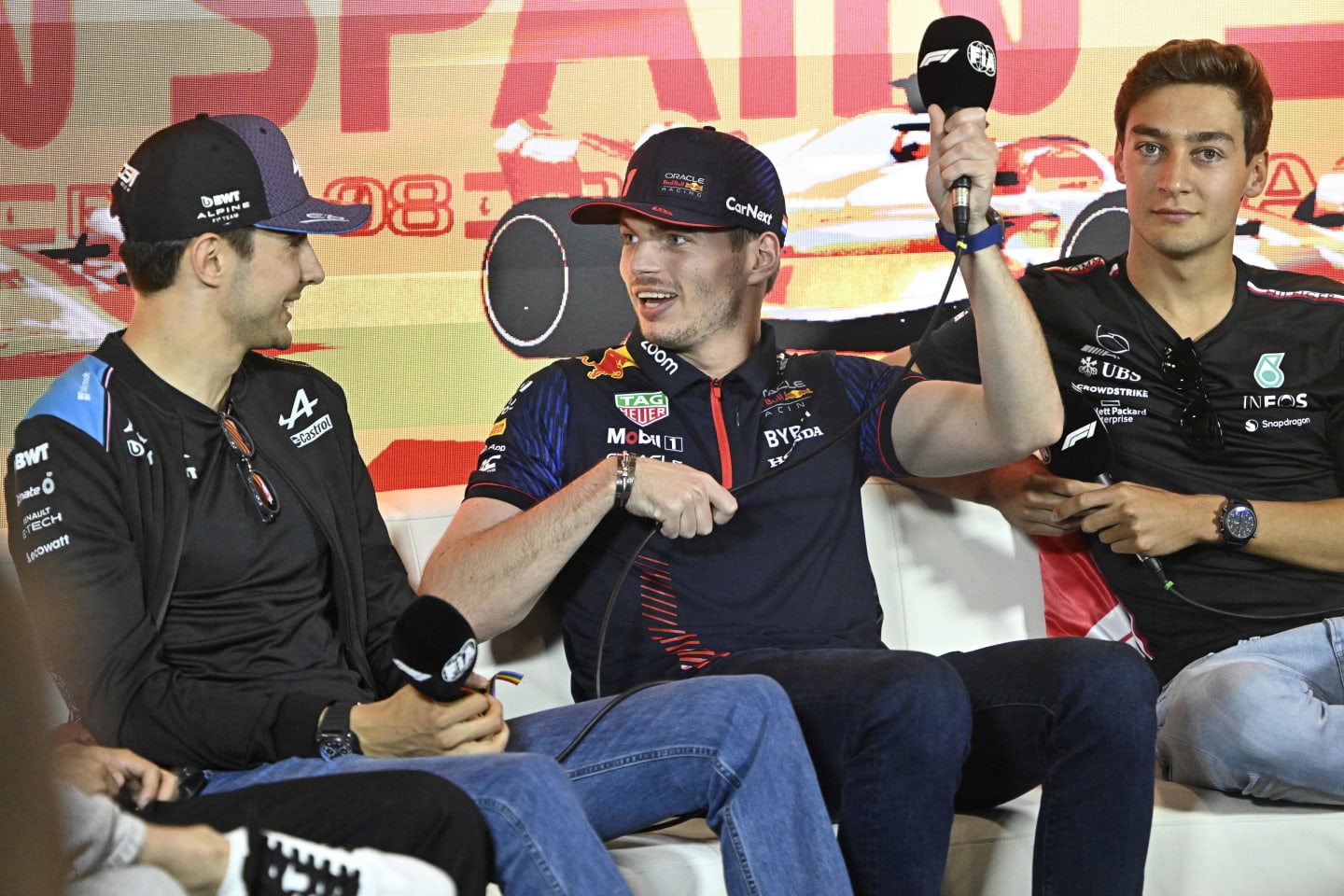 (From L) Alpine's French driver Esteban Ocon, Red Bull Racing's Dutch driver Max Verstappen and Mercedes' British driver George Russell attend a press conference ahead of the Spanish Formula One Grand Prix at the Circuit de Catalunya on June 1, 2023 in Montmelo, on the outskirts of Barcelona. (Photo by JAVIER SORIANO / AFP) (Photo by JAVIER SORIANO/AFP via Getty Images)