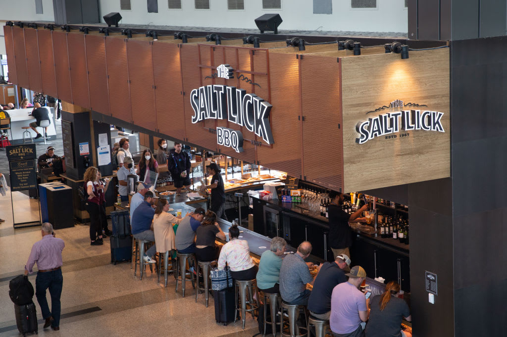 AUSTIN, TX - MAY 23:  People line up in the bar at The Salt Lick BBQ & Wine Cellars restaurant,