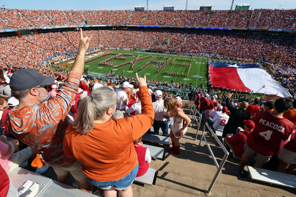 AUSTIN, TEXAS - OCTOBER 07: Texas Longhorns fans cheer as The University of Texas Longhorn Band