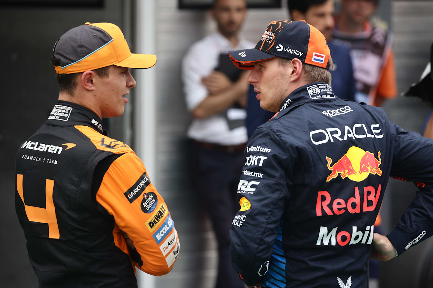 Lando Norris of McLaren and Max Verstappen of Red Bull Racing after qualifying ahead of the Formula