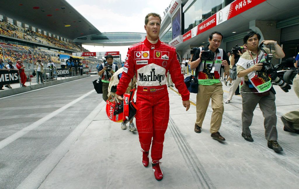 World Champion Micheal Schumacher of the Ferrari F1 team walks back to his pit after his car