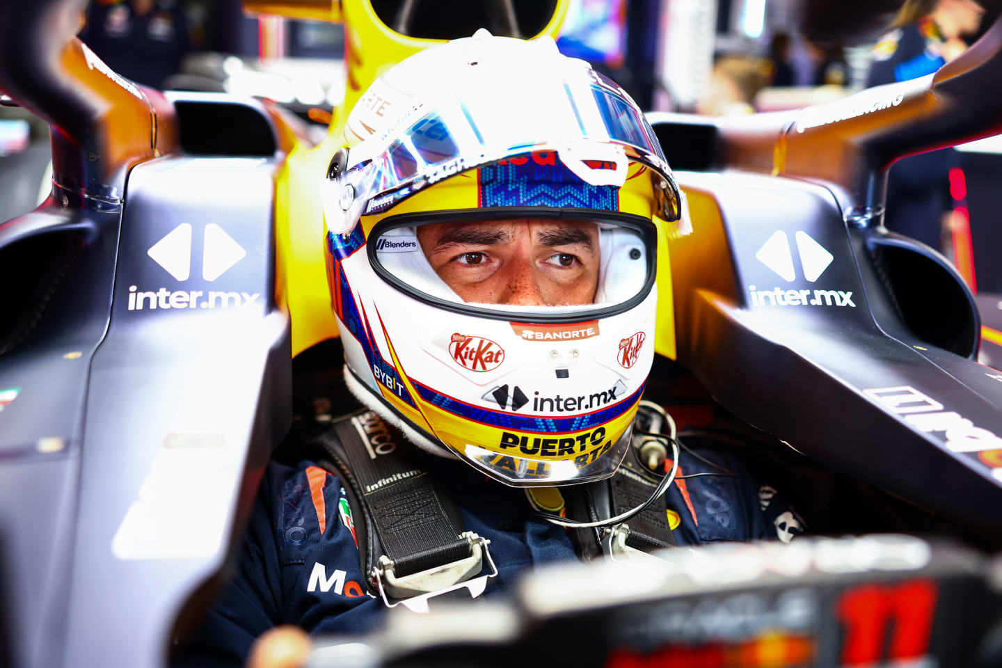 SUZUKA, JAPAN - APRIL 05: Sergio Perez of Mexico and Oracle Red Bull Racing prepares to drive in the garage during practice ahead of the F1 Grand Prix of Japan at Suzuka International Racing Course on April 05, 2024 in Suzuka, Japan. (Photo by Mark Thompson/Getty Images)