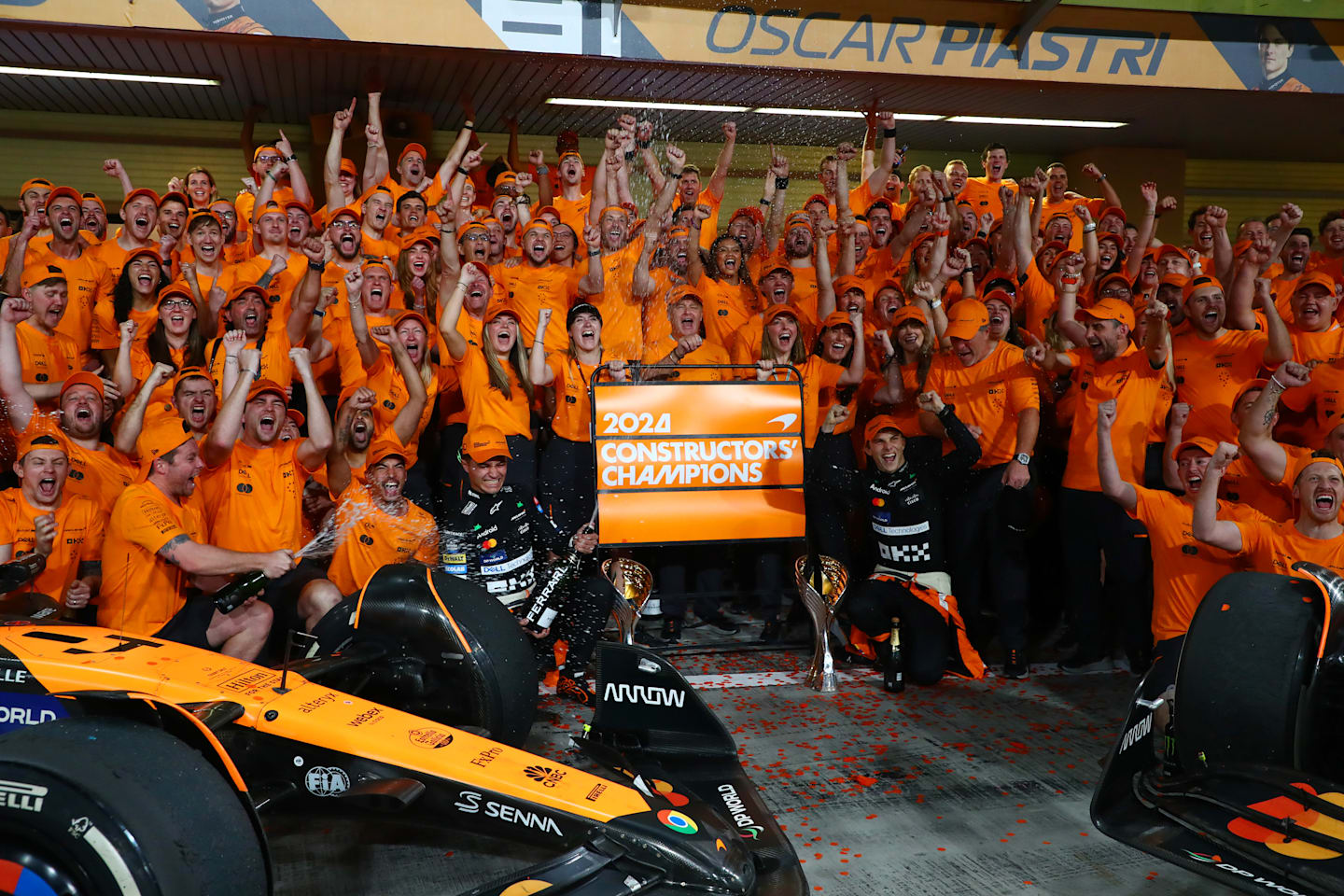 The McLaren team celebrate winning the 2024 F1 Constructors Championship after the F1 Grand Prix of Abu Dhabi at Yas Marina Circuit on December 08, 2024 in Abu Dhabi, United Arab Emirates. (Photo by Peter Fox - Formula 1/Formula 1 via Getty Images)
