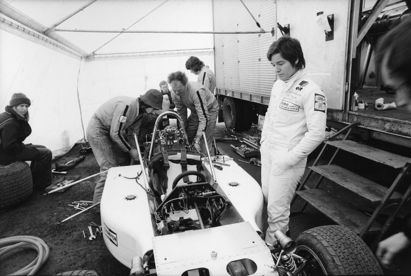 Lella Lombardi (1941-1992) looking at her March Formula 1 before racing at Brands Hatch March 27, 1975. (Photo by Ben Martin/Getty Images)