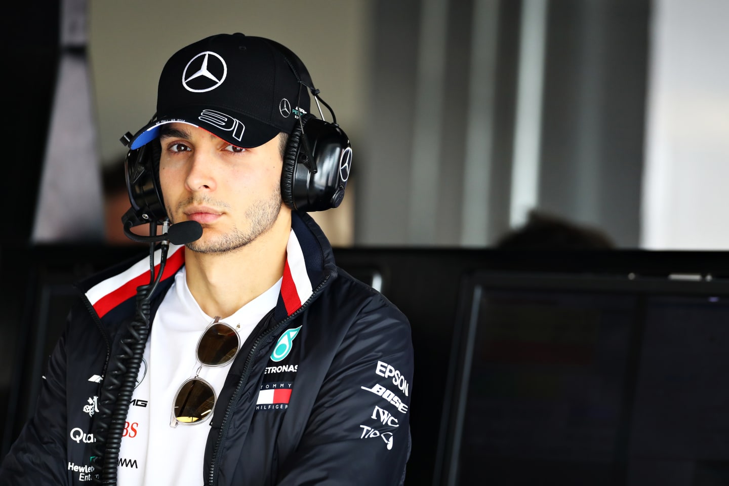 SUZUKA, JAPAN - OCTOBER 11: Esteban Ocon of France and Mercedes GP looks on in the garage during
