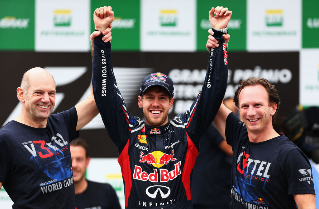 SAO PAULO, BRAZIL - NOVEMBER 25:  Sebastian Vettel (C) of Germany and Red Bull Racing celebrates