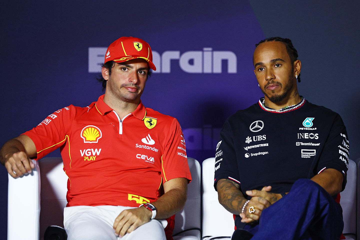 BAHRAIN, BAHRAIN - FEBRUARY 28: Carlos Sainz of Spain and Ferrari and Lewis Hamilton of Great