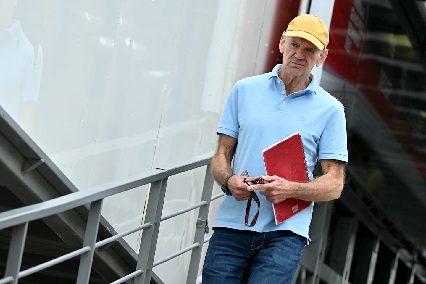 Red Bull Racing's technical chief Adrian Newey arrives in the pits of the Circuit de Monaco before