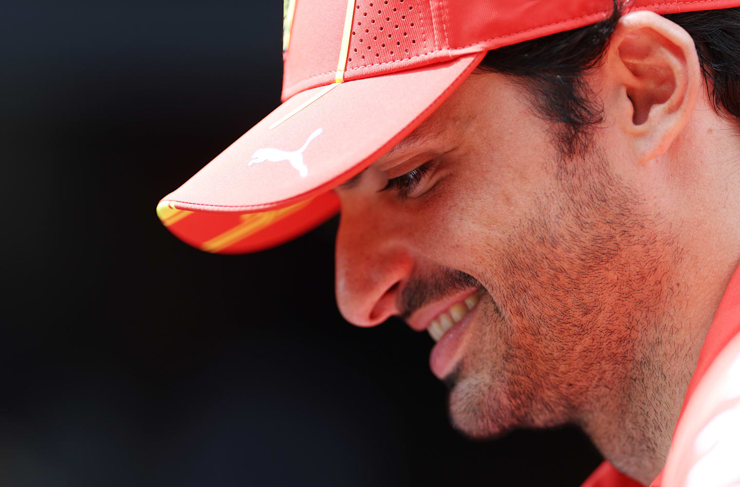 SPA, BELGIUM - JULY 25: Carlos Sainz of Spain and Ferrari looks on in the Paddock during previews