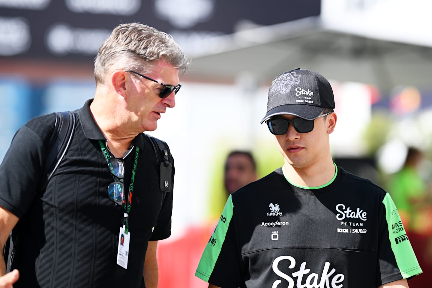 BAKU, AZERBAIJAN - SEPTEMBER 15: Zhou Guanyu of China and Stake F1 Team Kick Sauber talks with