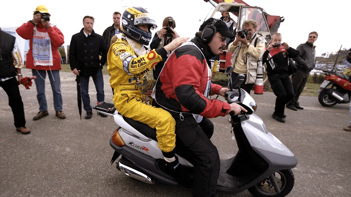 Frentzen was in the mix for victory again at the Nurburgring, only to end his day on the back of a scooter