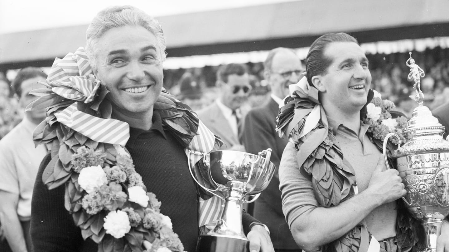 Taruffi (left) celebrates a second-place finish at Silverstone in 1952 alongside race winner Ascari