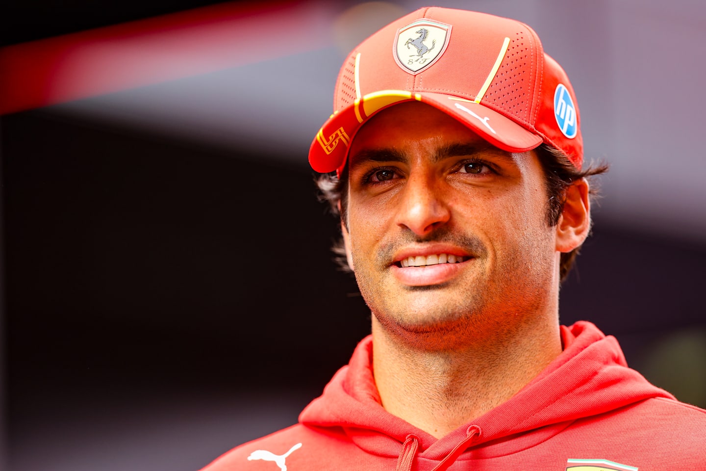 ZANDVOORT, NETHERLANDS - AUGUST 22: Carlos Sainz of Spain and Ferrari looks on in the paddock