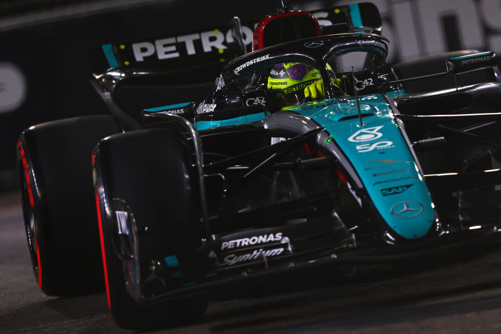 SINGAPORE, SINGAPORE - SEPTEMBER 21: Lewis Hamilton of Great Britain driving the (44) Mercedes AMG
