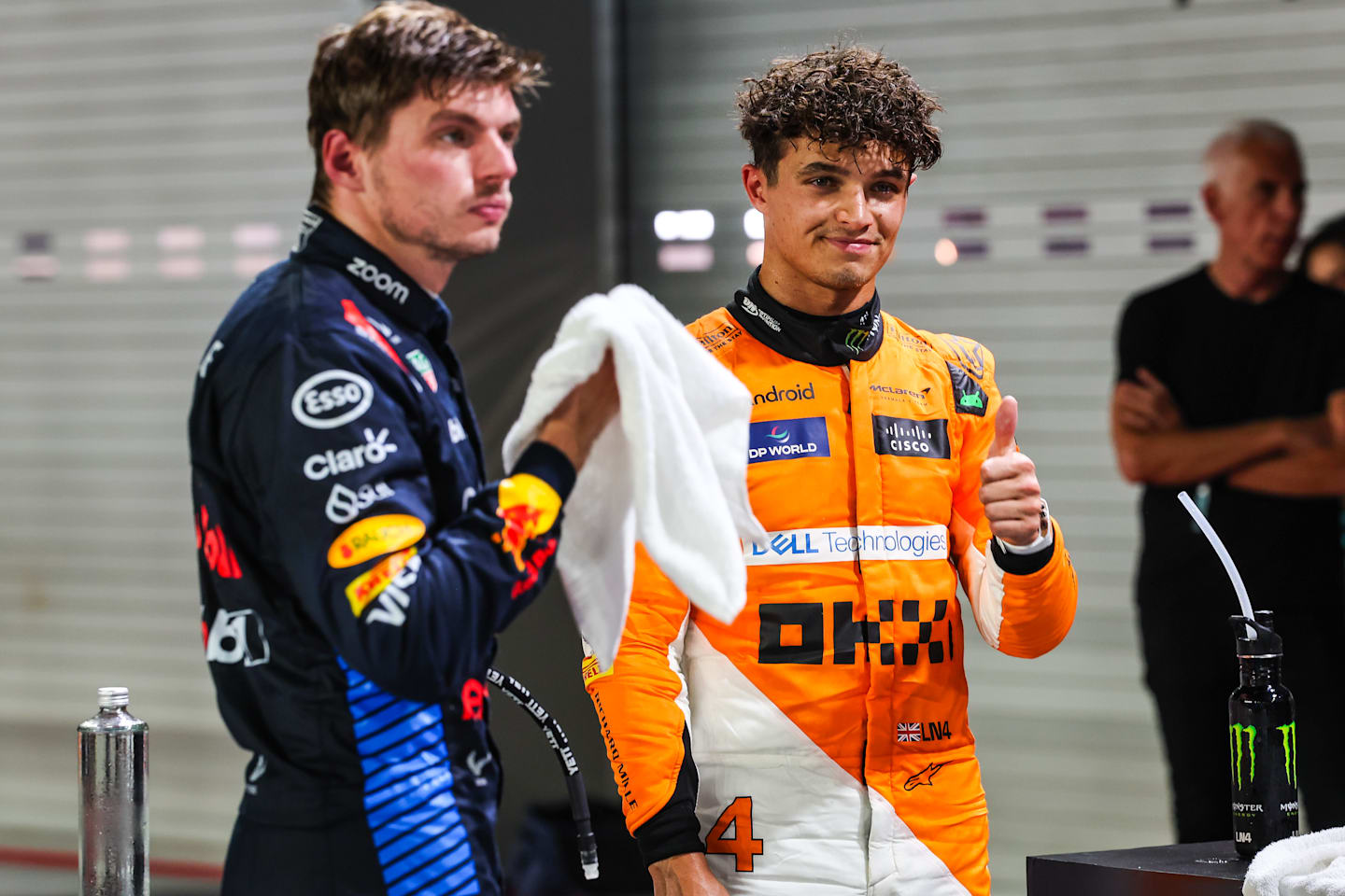 SINGAPORE, SINGAPORE - SEPTEMBER 21: Lando Norris of Great Britain and McLaren and Max Verstappen of the Netherlands and Oracle Red Bull Racing in parc ferme after qualifying ahead of the F1 Grand Prix of Singapore. (Photo by Kym Illman/Getty Images)