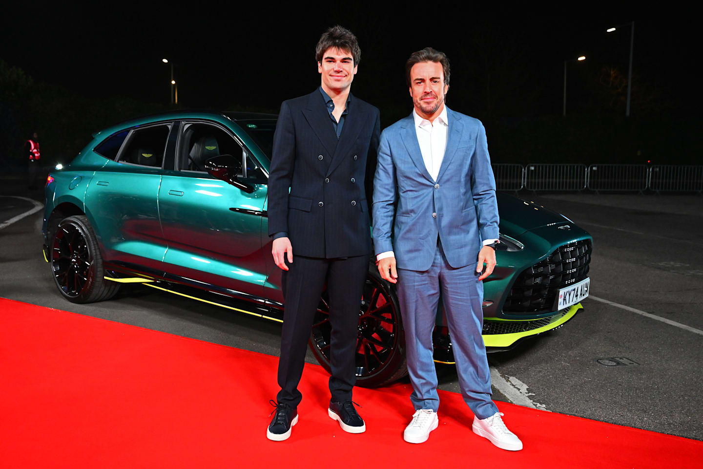 LONDON, ENGLAND - FEBRUARY 18: Lance Stroll of Canada and Aston Martin F1 Team Fernando Alonso of