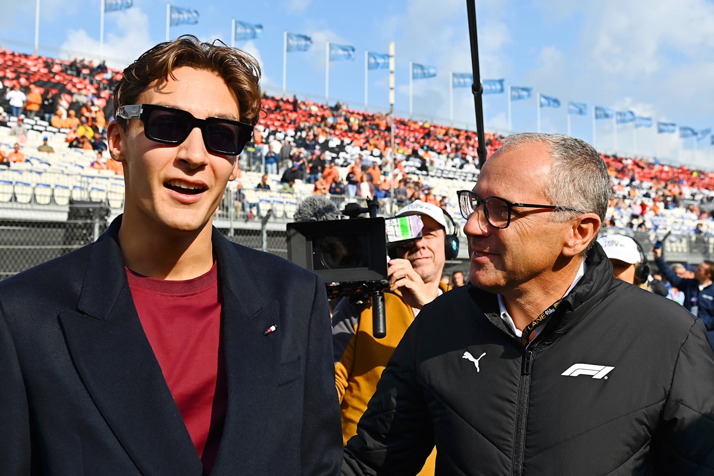 ZANDVOORT, NETHERLANDS - AUGUST 25: George Russell of Great Britain and Mercedes talks with Stefano