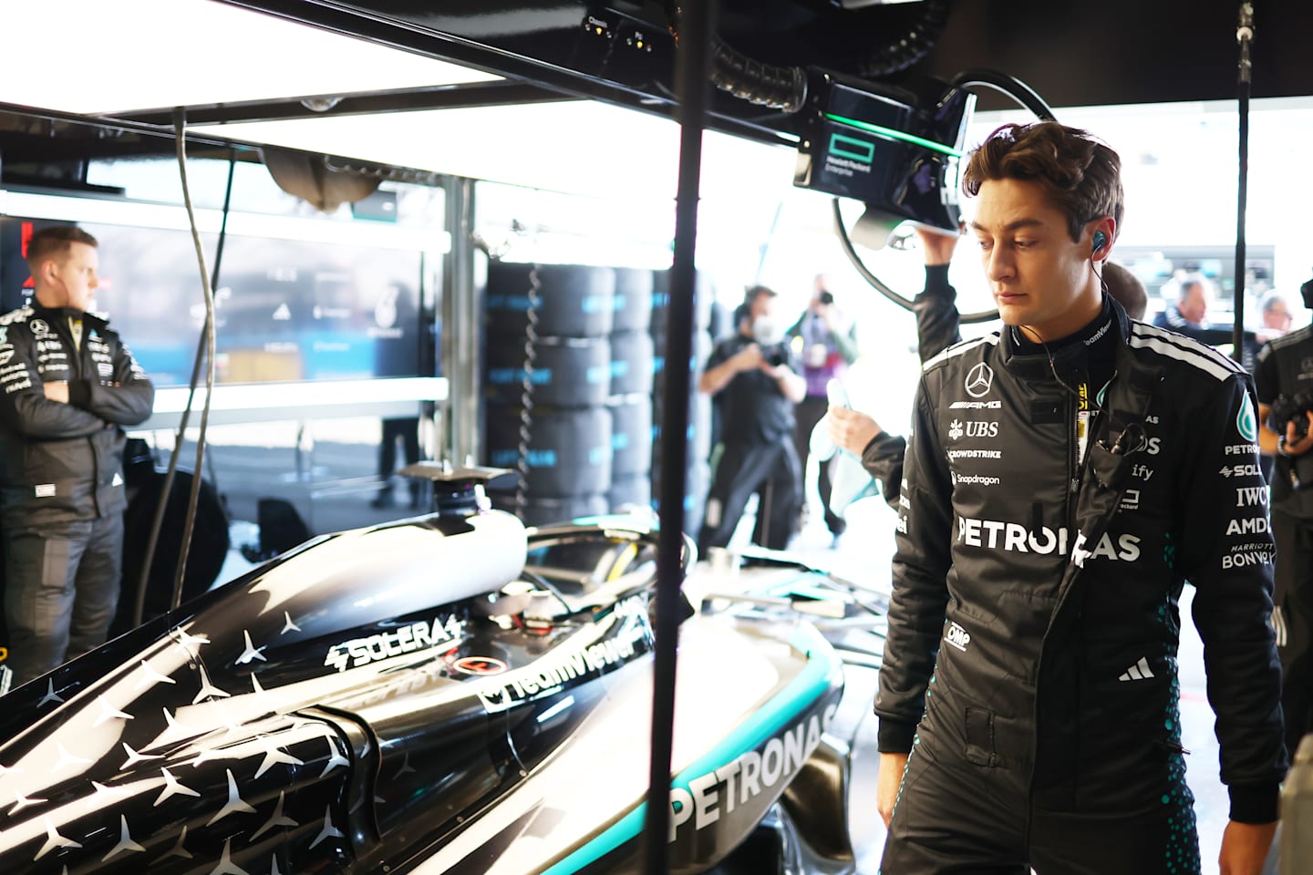 George Russell of Great Britain and Mercedes AMG Petronas F1 Team looks on in the garage  prior to practice ahead of the F1 Grand Prix of Japan at Suzuka Circuit on April 04, 2025 in Suzuka, Japan. (Photo by Sam Bloxham/LAT Images)