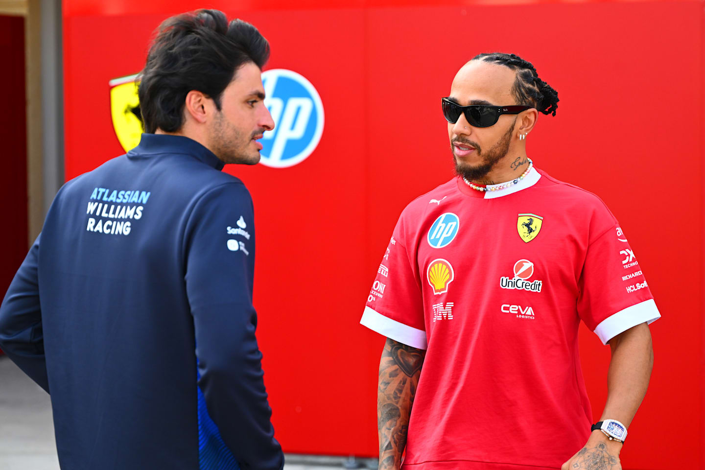 BAHRAIN, BAHRAIN - FEBRUARY 28: Lewis Hamilton of Great Britain and Scuderia Ferrari talks with