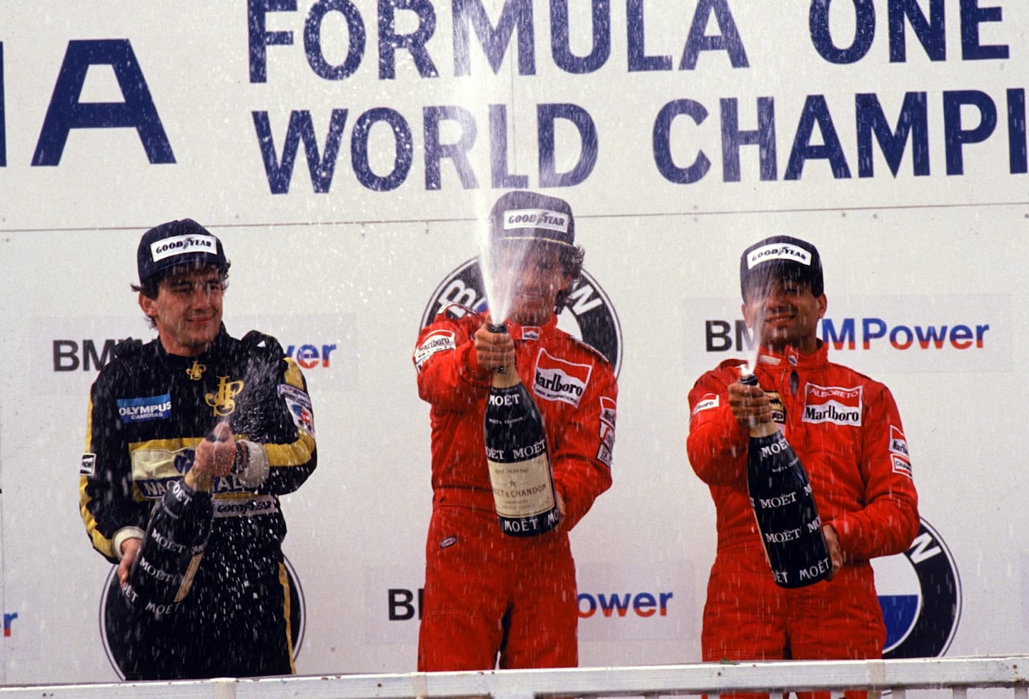 The podium (L to R): Ayrton Senna (BRA) Lotus second; Alain Prost (FRA) McLaren winner; Michele