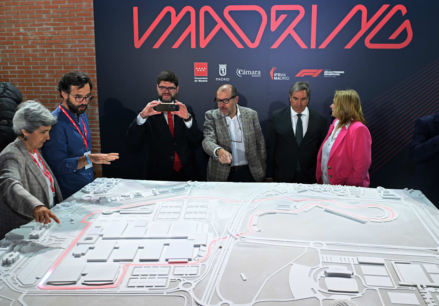MADRID, SPAIN - APRIL 25: Officials look at a model of the Formula 1 track during the F1 Madrid