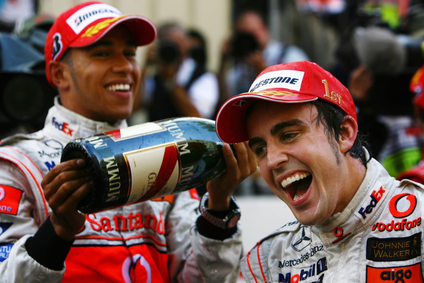 MONTE CARLO, MONACO - MAY 27:  Fernando Alonso (R) of Spain and McLaren Mercedes celebrates with