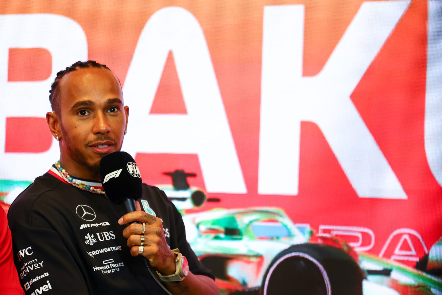 BAKU, AZERBAIJAN - APRIL 27: Lewis Hamilton of Great Britain and Mercedes talks in a press conference during previews ahead of the F1 Grand Prix of Azerbaijan at Baku City Circuit on April 27, 2023 in Baku, Azerbaijan. (Photo by Bryn Lennon/Getty Images)