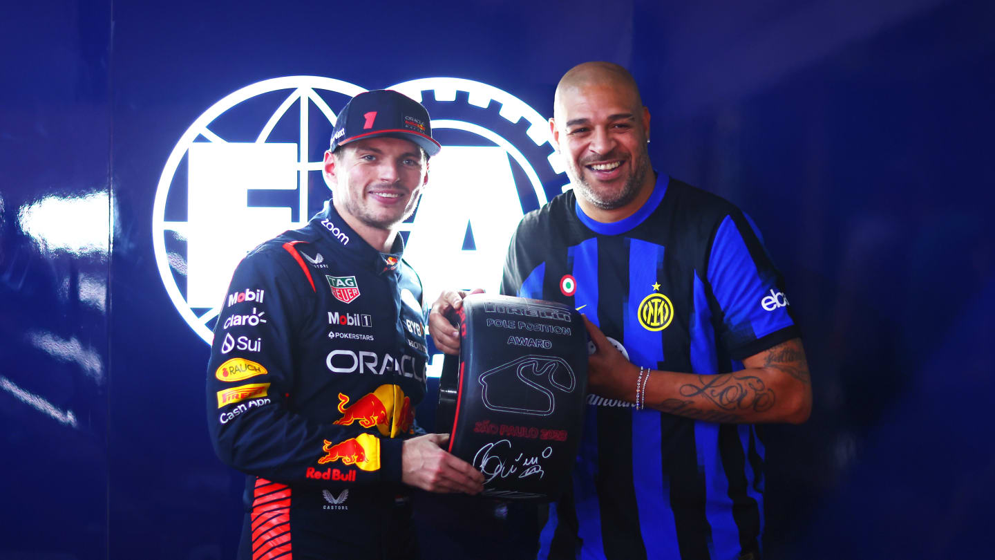 SAO PAULO, BRAZIL - NOVEMBER 03: Pole position qualifier Max Verstappen of the Netherlands and Oracle Red Bull Racing is presented with the Pirelli Pole Position award by Adriano after qualifying ahead of the F1 Grand Prix of Brazil at Autodromo Jose Carlos Pace on November 03, 2023 in Sao Paulo, Brazil. (Photo by Dan Istitene - Formula 1/Formula 1 via Getty Images)