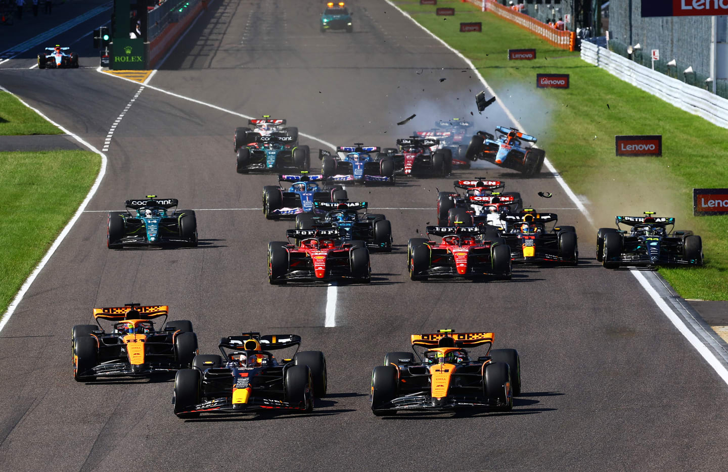 SUZUKA, JAPAN - SEPTEMBER 24: Max Verstappen of the Netherlands driving the (1) Oracle Red Bull Racing RB19 leads Lando Norris of Great Britain driving the (4) McLaren MCL60 Mercedes and Oscar Piastri of Australia driving the (81) McLaren MCL60 Mercedes going into the first corner at the start of the race during the F1 Grand Prix of Japan at Suzuka International Racing Course on September 24, 2023 in Suzuka, Japan. (Photo by Mark Thompson/Getty Images)