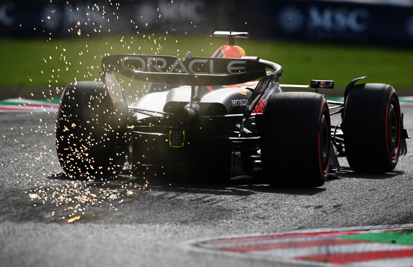 SUZUKA, JAPAN - SEPTEMBER 23: Sparks fly behind Max Verstappen of the Netherlands driving the (1) Oracle Red Bull Racing RB19 during qualifying ahead of the F1 Grand Prix of Japan at Suzuka International Racing Course on September 23, 2023 in Suzuka, Japan. (Photo by Clive Mason/Getty Images)