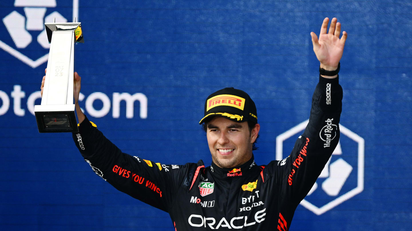 MIAMI, FLORIDA - MAY 07: Second placed Sergio Perez of Mexico and Oracle Red Bull Racing celebrates on the podium during the F1 Grand Prix of Miami at Miami International Autodrome on May 07, 2023 in Miami, Florida. (Photo by Clive Mason - Formula 1/Formula 1 via Getty Images)