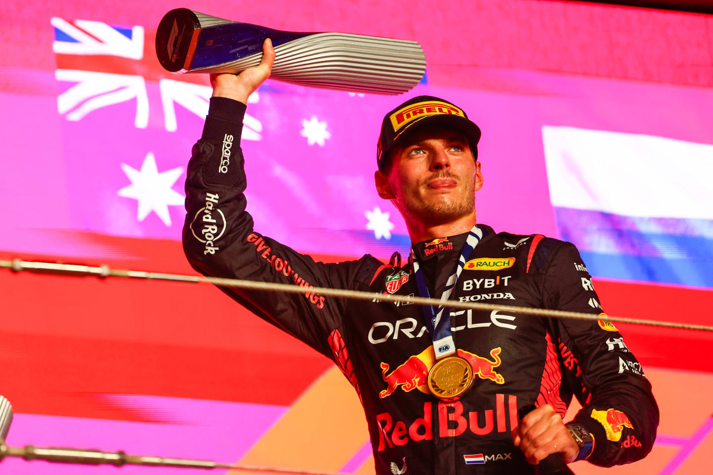 LUSAIL CITY, QATAR - OCTOBER 08: Race winner Max Verstappen of the Netherlands and Oracle Red Bull Racing celebrates on the podium during the F1 Grand Prix of Qatar at Lusail International Circuit on October 08, 2023 in Lusail City, Qatar. (Photo by Mark Thompson/Getty Images)
