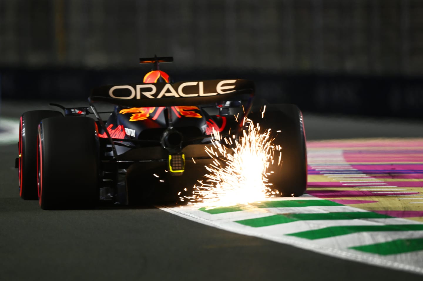 JEDDAH, SAUDI ARABIA - MARCH 17: Sparks fly behind Max Verstappen of the Netherlands driving the (1) Oracle Red Bull Racing RB19 during practice ahead of the F1 Grand Prix of Saudi Arabia at Jeddah Corniche Circuit on March 17, 2023 in Jeddah, Saudi Arabia. (Photo by Clive Mason/Getty Images)